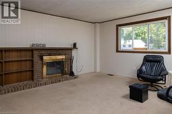 Brick fireplace with an integrated wood-finish mantel and built-in shelving - 