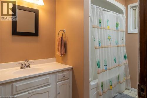 White vanity with integrated sink and chrome faucet - 52 Brier Park Road, Brantford, ON 