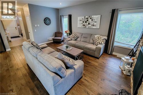 Hardwood-finish flooring, recessed lighting, and a front entry door with a transom window - 4274 Sixth Avenue, Niagara Falls, ON 