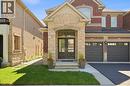 Brick and stone facade with arched entry - 3352 Hiscott Avenue, Burlington, ON 