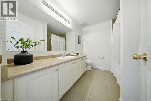 Vanity with integrated sink, extensive counter space, and cabinet storage - 3352 Hiscott Avenue, Burlington, ON 