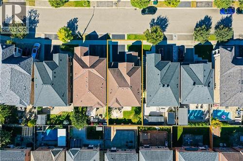 Aerial perspective showcasing a single-family residence with a multi-gabled roofline and an attached garage - 3352 Hiscott Avenue, Burlington, ON 