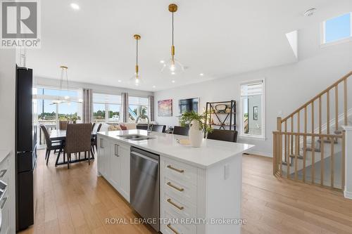 High-end custom hardware on the kitchen cabinets - 715 Maverick Crescent, Ottawa, ON 