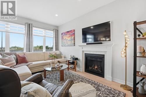 Gas fireplace & zebra blinds - 715 Maverick Crescent, Ottawa, ON 
