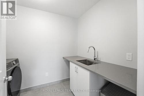Laundry room - stone counters & designated sink - 715 Maverick Crescent, Ottawa, ON 