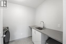 Laundry room - stone counters & designated sink - 