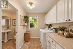 Main floor laundry - virtually staged - 