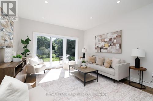 Living room has doors to the backyard. - 3 Peel Street, St. Catharines (Port Dalhousie), ON 