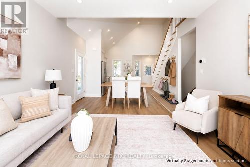 Virtually staged coats and boots section. - 3 Peel Street, St. Catharines (Port Dalhousie), ON 