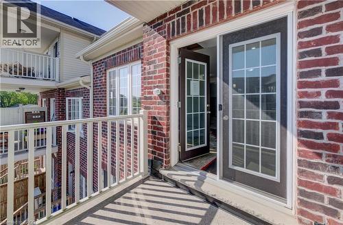 Upper-level balcony featuring white railings and a concrete floor - 403 Westwood Drive Unit# 59, Kitchener, ON 