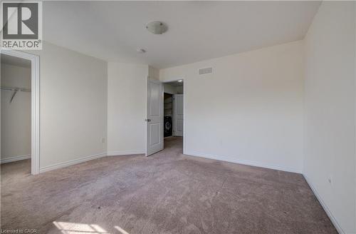 Carpeted interior with light-toned walls and white trim - 403 Westwood Drive Unit# 59, Kitchener, ON 
