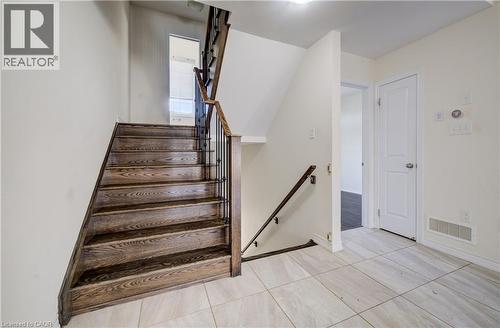 Hardwood staircase with wrought iron spindles and wood handrails - 403 Westwood Drive Unit# 59, Kitchener, ON 