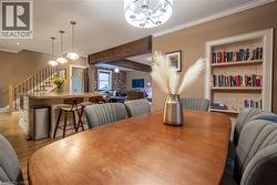Built-in shelving, crown molding, and wood-finish flooring - 