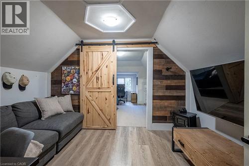 Sliding barn door with black hardware - 283 Plains Road W, Burlington, ON 
