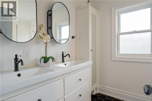 Dual vanity with integrated sinks and matte black fixtures - 283 Plains Road W, Burlington, ON 