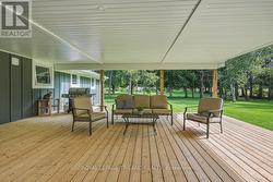 Back Deck: Expansive Covered Back Deck - 