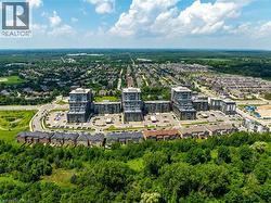 Aerial perspective showcasing residential buildings and expansive green spaces - 