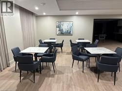 Recessed lighting, wood-finish flooring, and light-toned walls - 