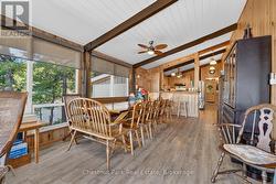 Dining Room & Wall of Windows Overlooking the Lake - 