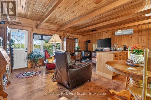 Living Room w Lakeside Exit to Wrap-Around Porch - 1048 Nora Lane, Gravenhurst (Ryde), ON 