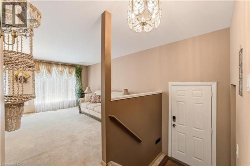 Spacious entrance off the driveway with closet and stairs to main level - 450 Brigadoon Drive, Hamilton, ON 