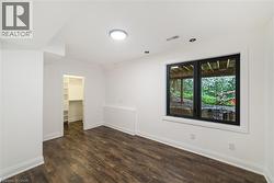 Bedroom at grade can be used as an office or workout area - 