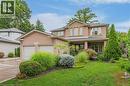 Brick exterior with a covered porch entry - 52 Archwood Crescent, Cambridge, ON 