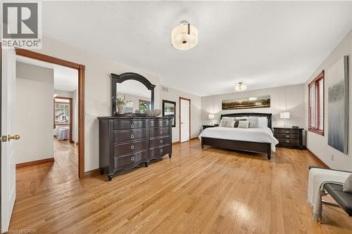 Hardwood flooring, painted walls, ceiling-mounted light fixtures, and wood-trimmed window - 52 Archwood Crescent, Cambridge, ON 
