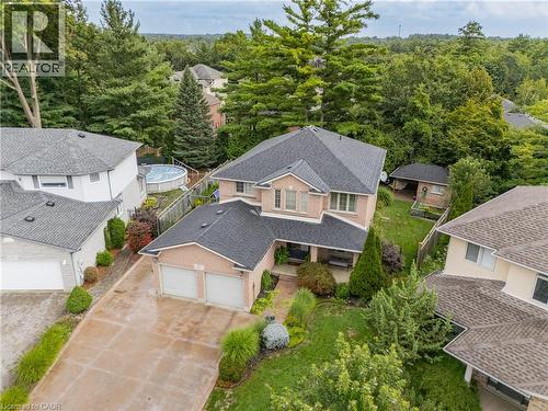 Brick exterior, attached two-car garage, established landscaping, and a covered back patio - 52 Archwood Crescent, Cambridge, ON 