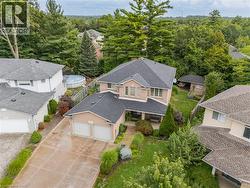 Brick exterior, attached two-car garage, established landscaping, and a covered back patio - 