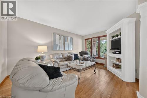 Hardwood flooring, large windows, light-colored walls, and built-in shelving - 52 Archwood Crescent, Cambridge, ON 