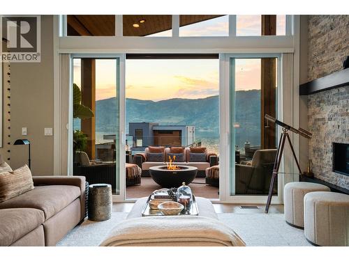 Living room at dusk - 1666 Lakestone Drive, Lake Country, BC 