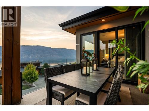 Outdoor dining at twilight - 1666 Lakestone Drive, Lake Country, BC 