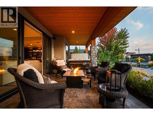 Lower Level patio to Hot Tub at twilight - 1666 Lakestone Drive, Lake Country, BC 