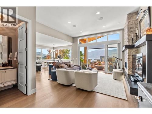 Entering the Living room w/ powder room to the left - 1666 Lakestone Drive, Lake Country, BC 