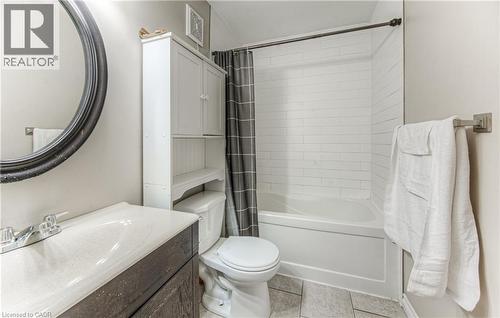 Full bathroom with shower / bath combo, light tile patterned floors, and vanity - 283 Fairway Road N Unit# 501, Kitchener, ON 