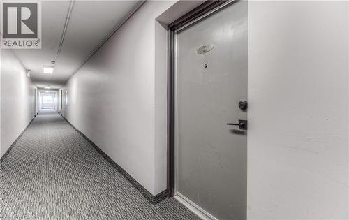 Corridor featuring carpet and baseboards - 283 Fairway Road N Unit# 501, Kitchener, ON 