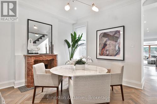 Elegant dining room with marble fireplace - 69 Sullivan Street, Toronto, ON 