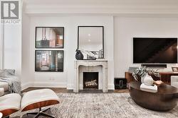 Two gorgeous marble fireplaces flank living space - 