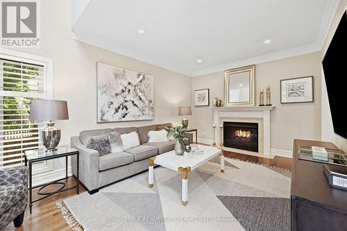 Family Room Features an Elegant Gas Fireplace - 340 Oakridge Court, Oakville, ON 