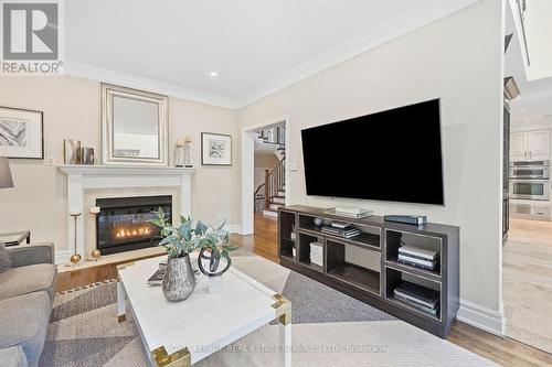 Family Room Features an Elegant Gas Fireplace - 340 Oakridge Court, Oakville, ON 