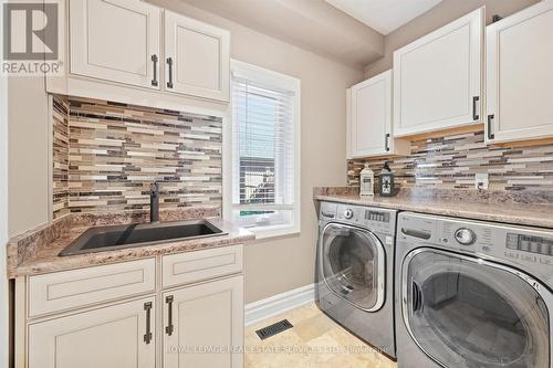 Main Floor Laundry Room with Garage Access - 340 Oakridge Court, Oakville, ON 