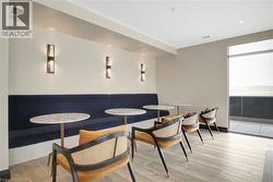 Dining area featuring light wood-style floors and recessed lighting - 