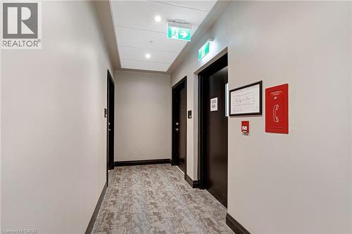 Hallway with recessed lighting and elevator - 50 Grand Avenue S Unit# 801, Cambridge, ON 
