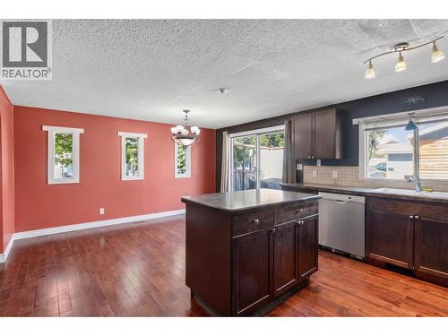 The kitchen has been virtually decluttered for presentation purposes. - 1311 25Th Avenue, Vernon, BC 