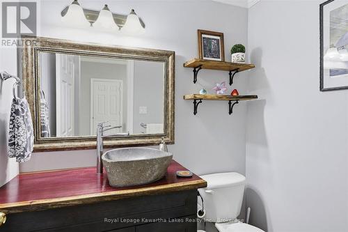 Powder room with unique and homemade counter. - 10G - 25 Rivermill Boulevard, Kawartha Lakes (Lindsay), ON 