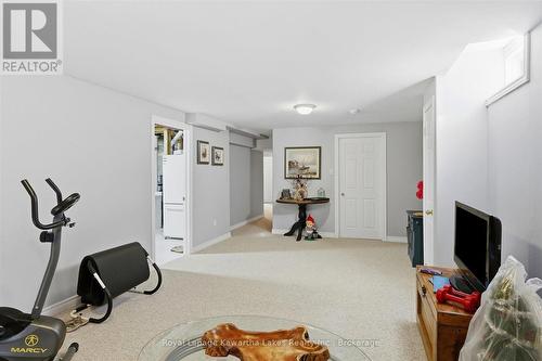 Recroom with newer carpet. - 10G - 25 Rivermill Boulevard, Kawartha Lakes (Lindsay), ON 