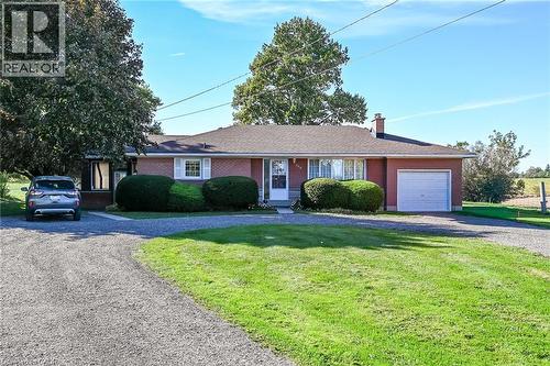 Brick exterior with white window shutters - 799 Highway 6, Caledonia, ON 