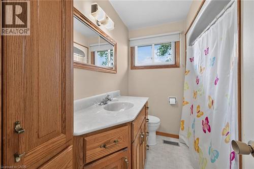 Wood-finish vanity with an integrated sink and laminate countertop - 799 Highway 6, Caledonia, ON 