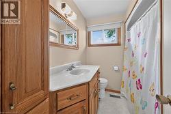 Wood-finish vanity with an integrated sink and laminate countertop - 